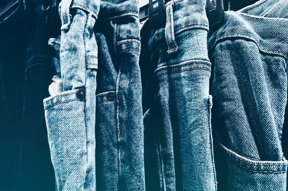 Denim jeans hanging on a rail
