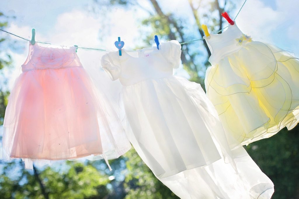 Children's dresses drying on a clothes line